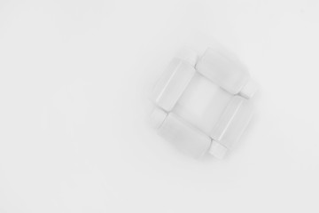 White bottles on a white background