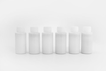 White bottles on a white background
