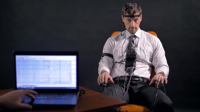 Man connected to the lie detector circuit.