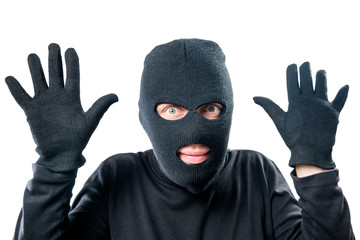 Robber in black protective clothing with hands up close-up portrait