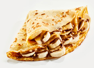 Fresh banana crepes drizzled with chocolate sauce - obrazy, fototapety, plakaty