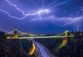 Fototapeta na wymiar Lightning Over Suspension Bridge
