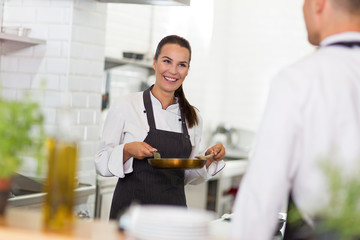 Female chef in kitchen
