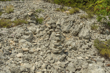zen stone piles on the top of the hill at Pasman island in Croatia