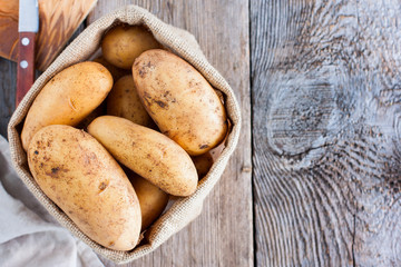 Young raw potatoes, copy space, top view
