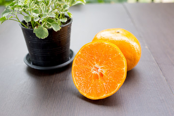 fresh oranges on the brown wooden table