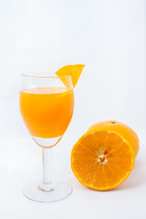 Orange juice and slices isolated on white