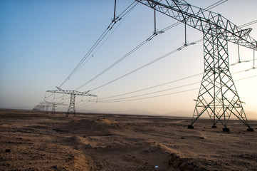 High voltage power lines in desert valley