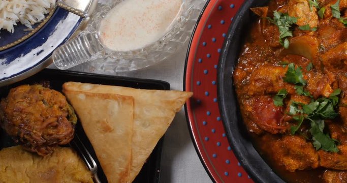 Dolly top down view of a delicious chicken tikka masala with Indian spices
