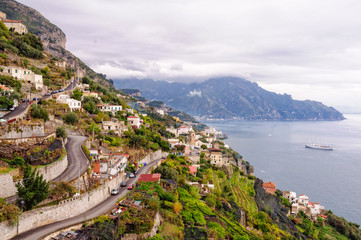 Hairpin bends of narrow zigzagging streets that climb up the steep slopes - Amalfi, Campania, Italy