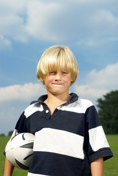 Boy Holding Rugby Ball