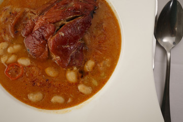 Bean soup arranged in a plate, Traditional dish in elegant setting, Selective focus with soft light
