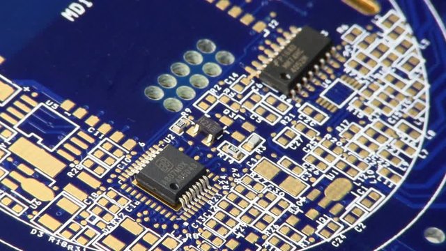 Surface mount circuit components of all shapes and sizes magically appear and populate circuit board.