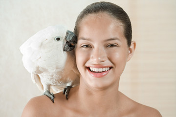 Girl with pet cockatoo