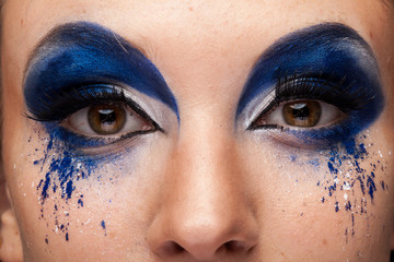 Close up image of beautiful woman with creative makeup in studio photo