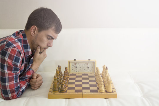 Man playing chess. Play with God or with yourself. Concept - strategy  goals, efforts, plans. Stock Photo