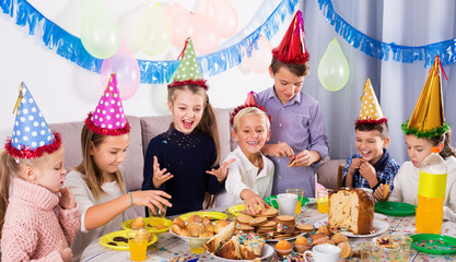 Children having birthday dinner