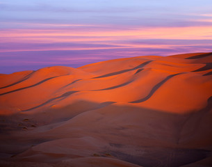 Fototapeta na wymiar Panorama of sand dunes in Sahara desert at sunset in Morocco, Africa