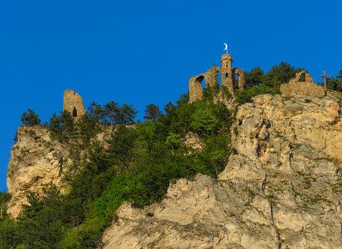 Outdoor color image of the landmark fortress ruin Tuerkensturz in Seebenstein, Austria, Europe,  located in a nature reserve, recreation, mountain bikingclimbing area, spring, golden sunlight