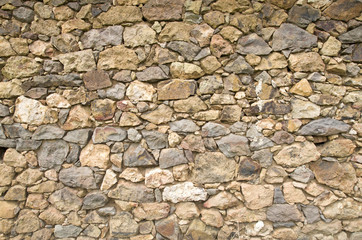 Old colorful stone wall closeup