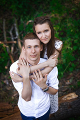 couple hugging in forest