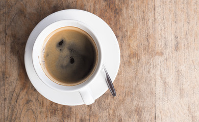 Coffee cup top view on wooden table background