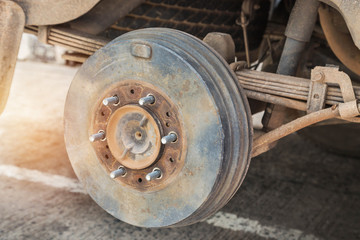 Rusty wheel hub car with drum brake system and suspension during change wheel tyre