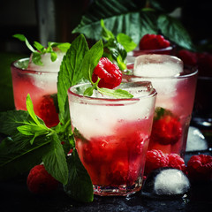 Raspberry drink with ice, selective focus