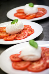 Three plates of fresh Italian Caprese salad