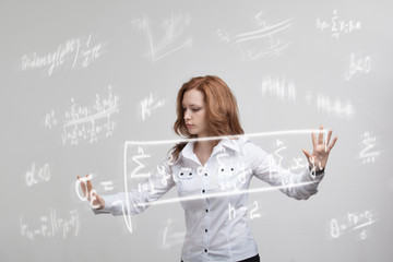 Woman scientist or student working with various high school maths and science formula.