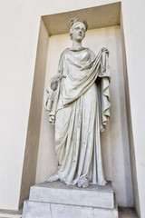 Statue of goddess holding sickle