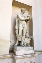 Antique hero holding head of enemy statue