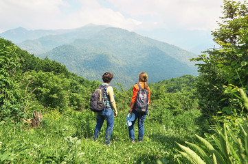 Fototapeta na wymiar Female hikers in mountains enjoying a beautiful view