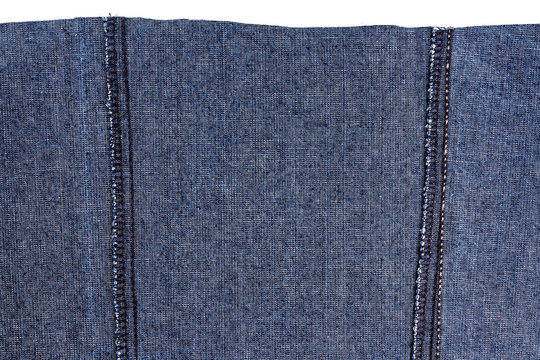 Piece of dark blue jeans fabric