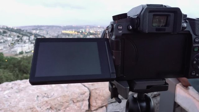 Camera shoots photo timelapse of the Jerusalem Old City view landscape. Mount Scopus is a famous Holy Land place and it has a fantastic view to the Old Jerusalem.