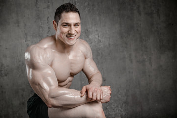 Obraz premium Brutal strong athletic men pumping up muscles