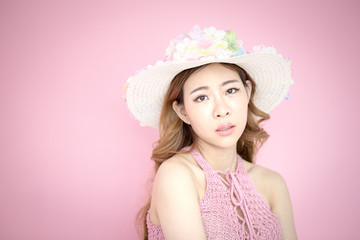 Beautiful korea woman posing at pink background with summer concept, isolated on pink background, 20-30 year old.