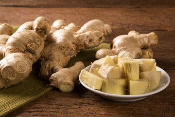 Fresh ginger root on the wooden table