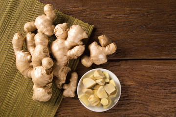 Fresh ginger root on the wooden table