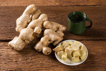 Fresh ginger root on the wooden table