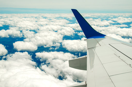 Beautiful sky with clouds and land view from plane
