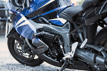 Fototapeta na wymiar Motorcycle luxury items close-up: headlights, shock absorber, wheel, wing, toning.