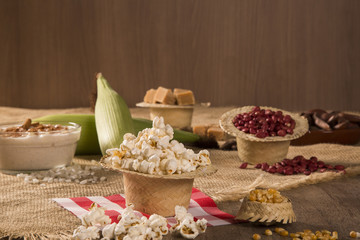 Corn maize and popcorns combined on a table. Brazilian Festa junina party.