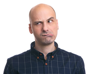 thoughtful bald man looking away