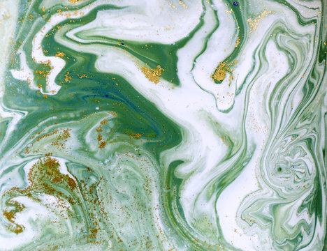 Marbled green and golden abstract background. Liquid marble pattern.