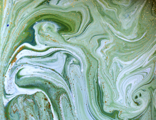 Marbled green and golden abstract background. Liquid marble pattern.