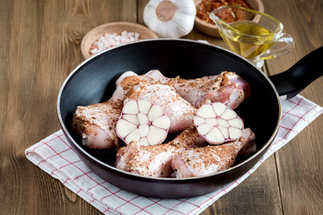 Ready to roast homemade chicken legs with garlic and spicy Marinaded chicken