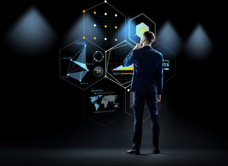businessman looking at virtual screen from back