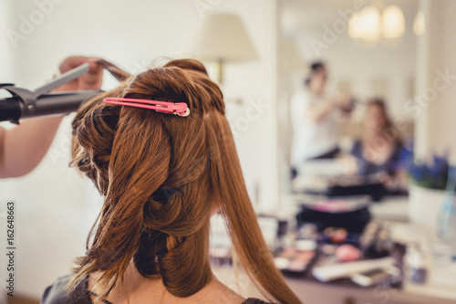 Redheaded Bride Gets Her Hair Done By A Wedding Hair Stylist