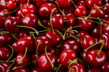 Ripe cherries on wooden table